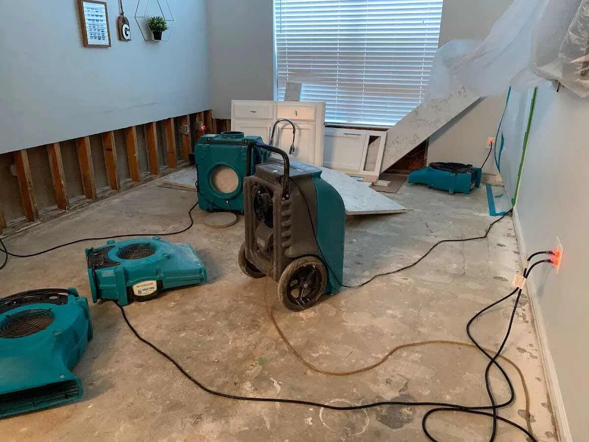Dehumidifier in flood-cut room for Water Damage Restoration in Primera